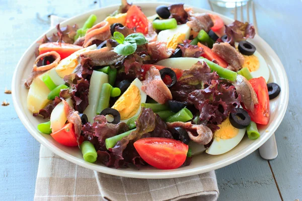 Mediterranean salad with anchovies and olives — Stock Photo, Image