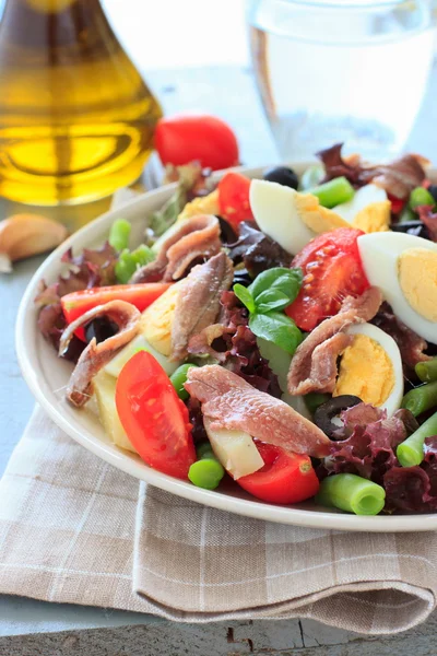 Mediterranean salad with anchovies and olives — Stock Photo, Image