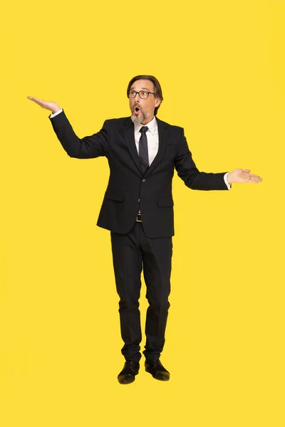 Amazed Middle Aged Businessman Black Suit Balancing Hands Invisible Objects — 스톡 사진