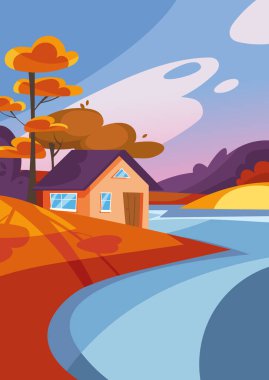 Güz mevsiminde göl kenarındaki ev.