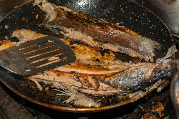 FRIED TROUT WITH OIL IN THE PAN