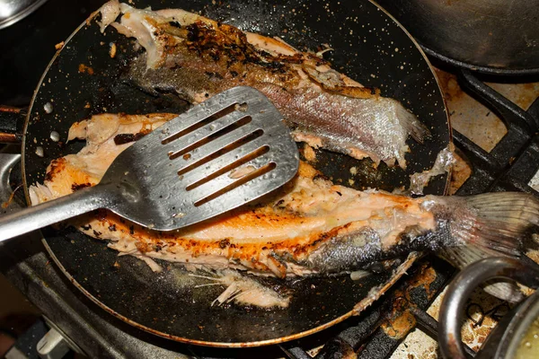 FRIED TROUT WITH OIL IN THE PAN