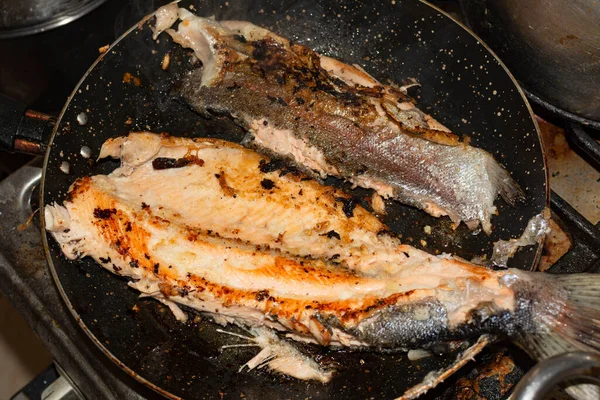 FRIED TROUT WITH OIL IN THE PAN