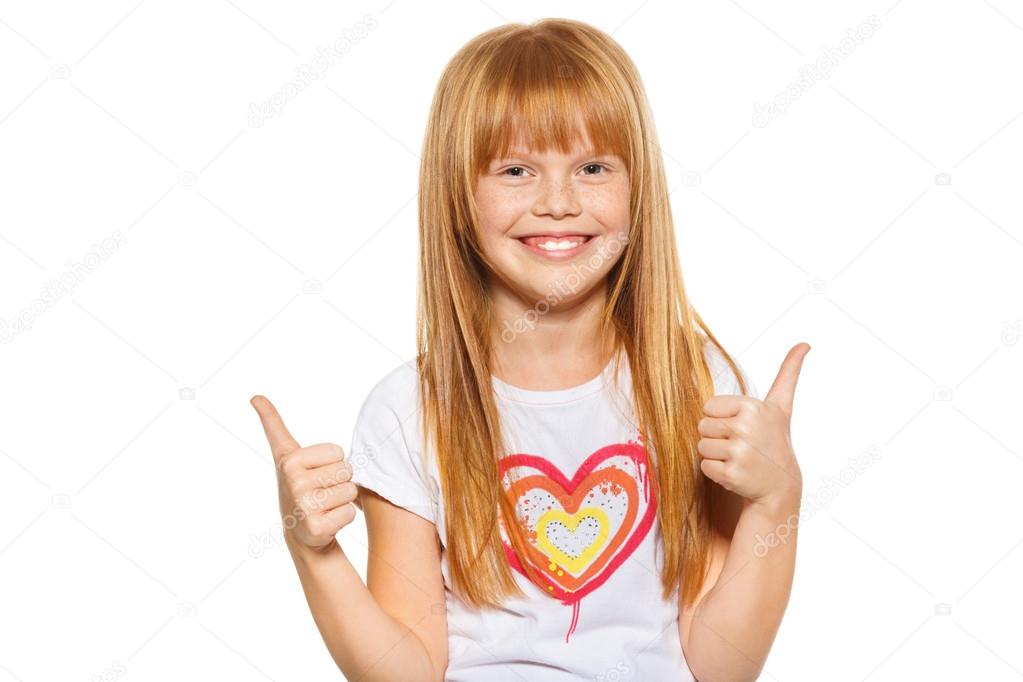 Cute little girl showing thumbs up with both hands, isolated on white background