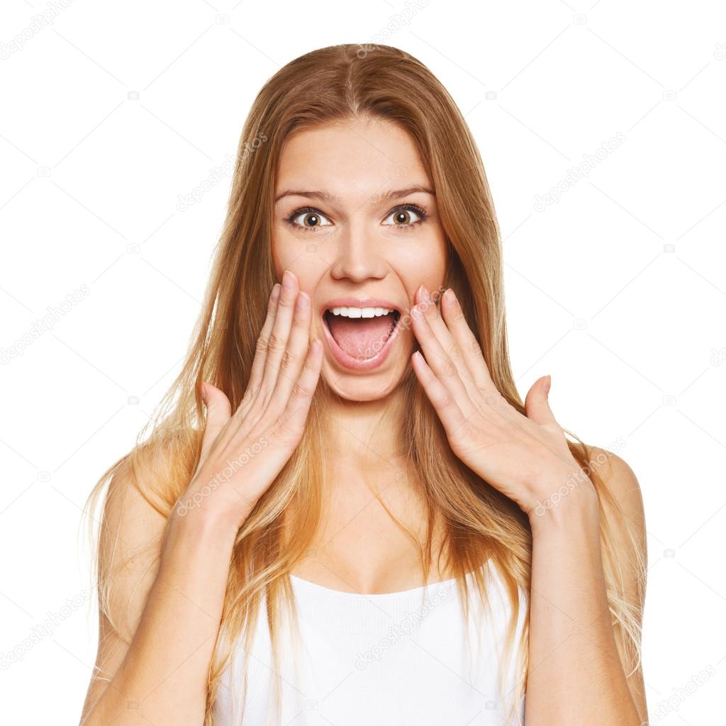 Surprised happy beautiful woman in excitement. Isolated over white background