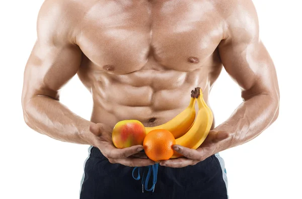 Shaped and healthy body man holding a fresh fruits, shaped abdominal — Stock Photo, Image