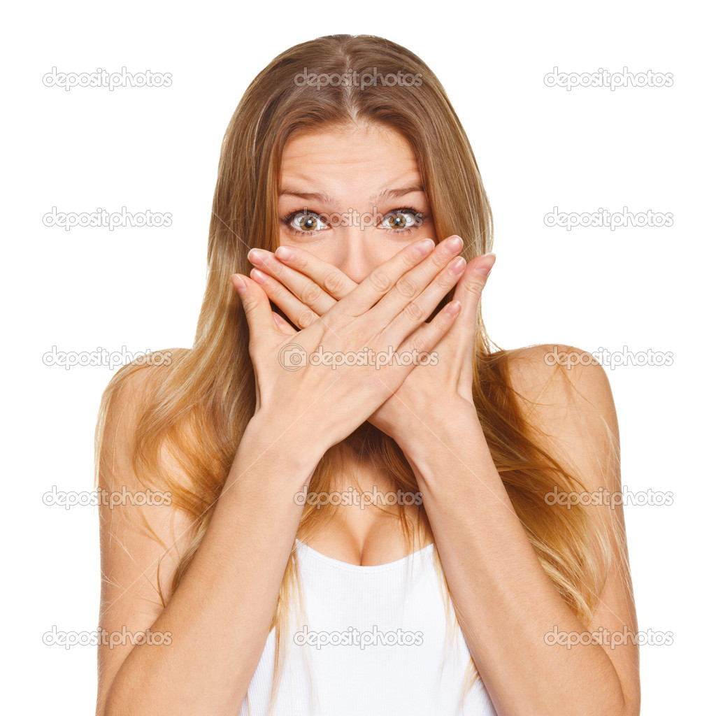 Surprised happy beautiful woman covering her mouth with hand. isolated over white background