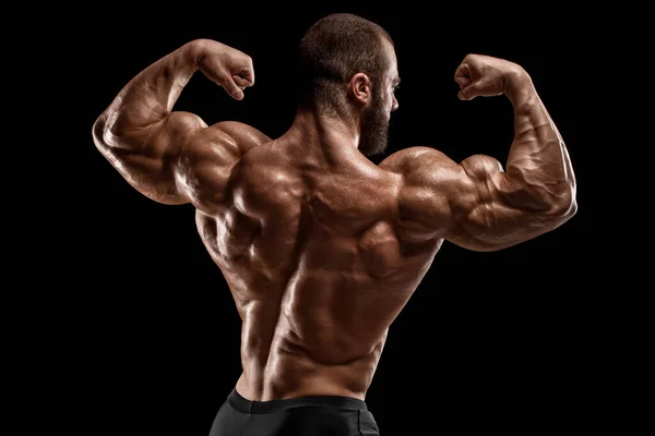 Hombre Musculoso Mostrando Músculos Espalda Aislado Sobre Fondo Negro Vista —  Fotos de Stock