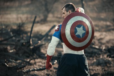 Man dressed as Captain America. Captain America cosplay costume