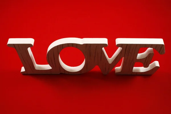 White letters love of wood on a red background — Stock Photo, Image