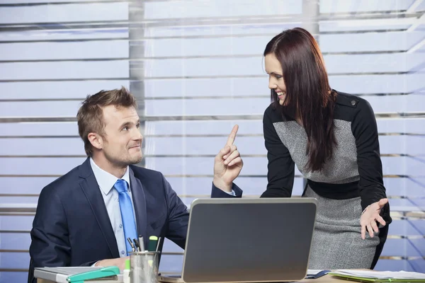 Man and woman joking around in office — Stock Photo, Image