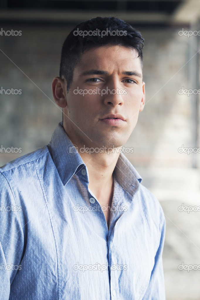 Outdoors portrait of a handsome man in shirt