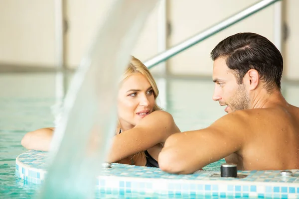 Attractive Young Couple Relaxing Indoor Hotel Swimming Pool — Stock Photo, Image