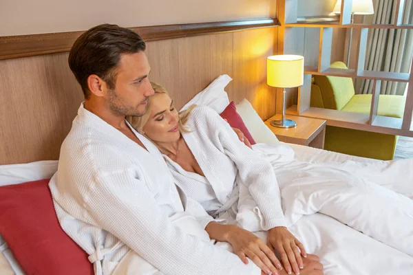 Handsome Couple Bathrobe Lying Bed Hotel Room — Stock Photo, Image