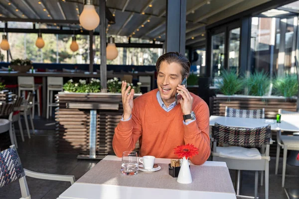 Handsome Man Sweater Talking Cell Phone Restaurant — 스톡 사진