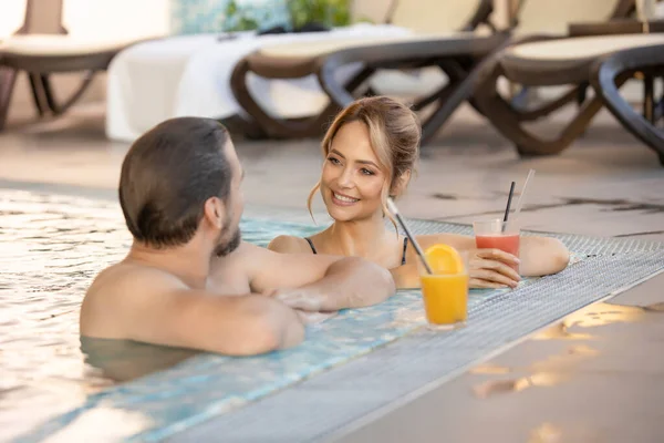 Happy Couple Drinking Juice Indoor Swimming Pool — Foto de Stock