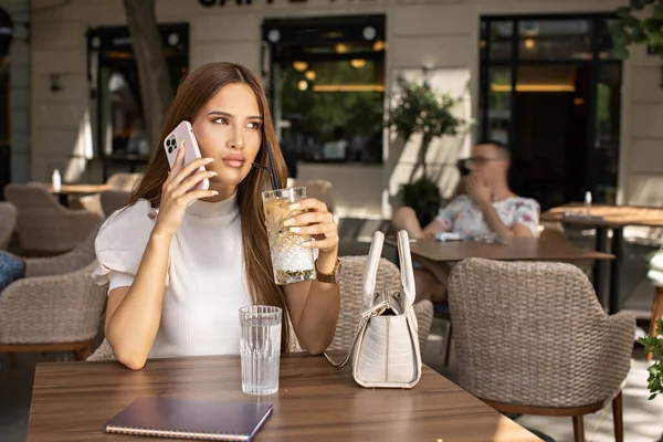 Young Woman Drinking Coffee Alone Talking Her Smartphone — Photo