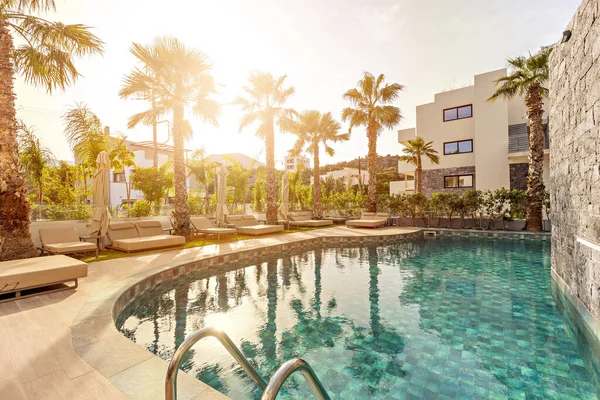 Sea hotel resort with swimming pool , morning sunlight