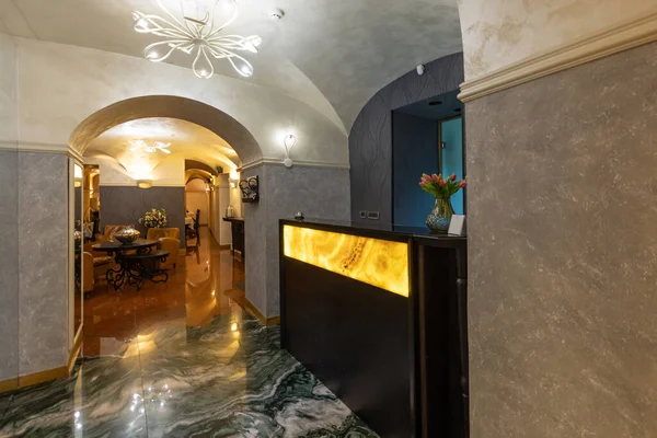 Hotel lobby interior with marble reception desk