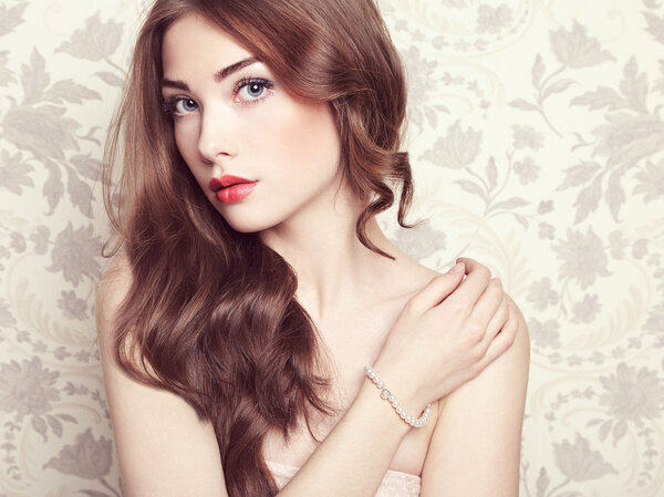 Portrait of young beautiful girl with wavy hair