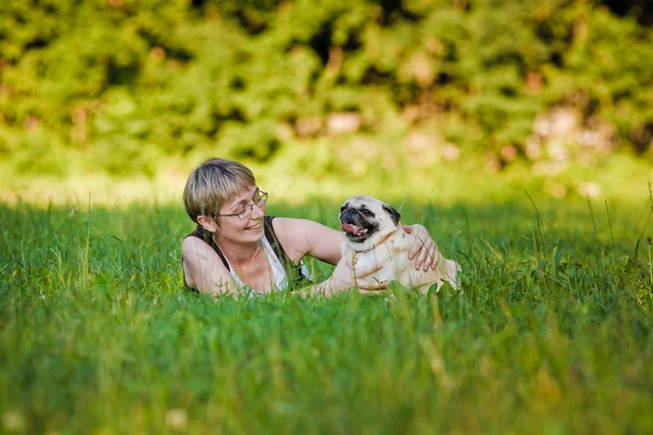 Young woman with her dog — Stock Photo, Image