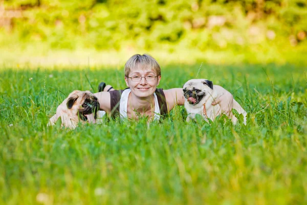 Young woman with her dogs — Stock Photo, Image