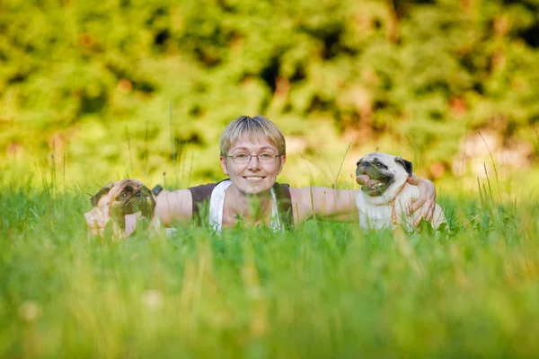 Young woman with her dogs — Stock Photo, Image