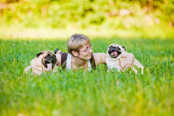 Young woman with her dogs — Stock Photo, Image