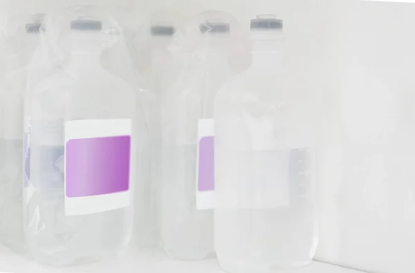 Hospital Medical Normal Saline Plastic Bottles Stacked Shelf Emergency Injection — Stock Photo, Image