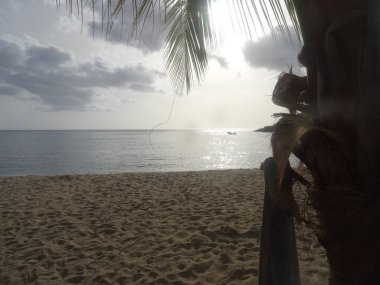 The setting sun reflects on the sea