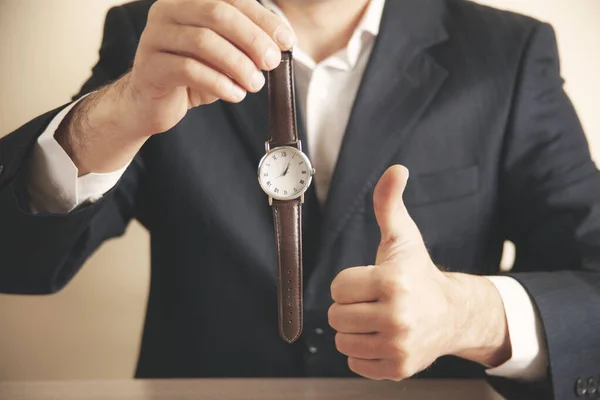 young business man hand watch  in office