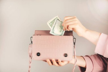woman hand money with bag