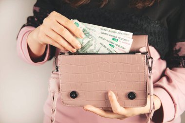 woman hand money with bag