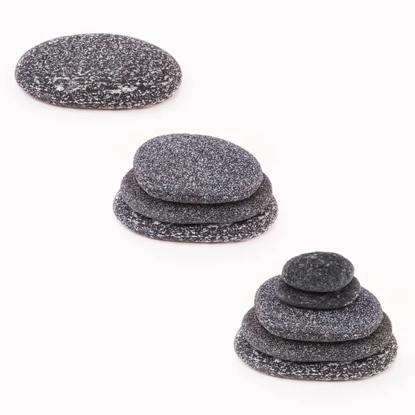 Black sea pebbles - set on white background — Stock Photo, Image