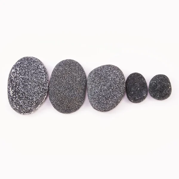 Black sea pebbles - set on white background — Stock Photo, Image