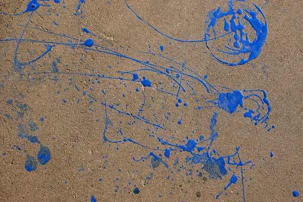 Asphalte avec des impressions de fond de peinture bleue — Photo