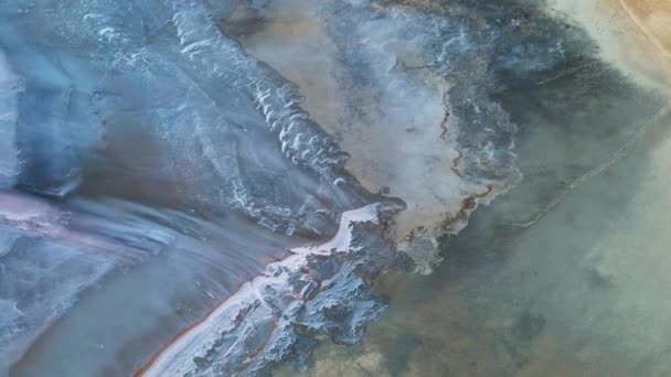 Scenic drone flight over dry pink lakebed with weird shape white dry salt pattern looks like alien landscape texture. Amazing aerial cinematic nature landscape beauty, perfect pink blue background — Stock Video