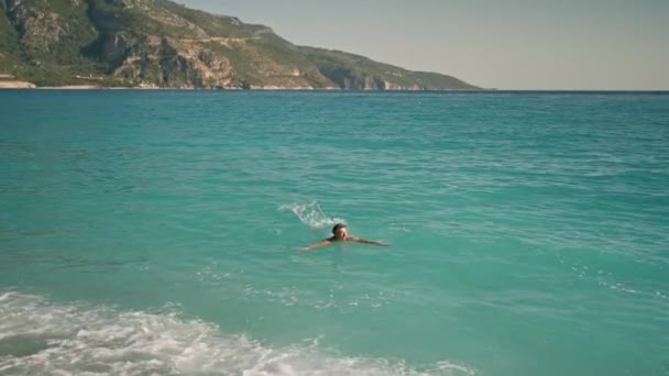 Slow Motion Footage Man Swims Shore Turquoise Water Mediterranean Sea — стоковое видео