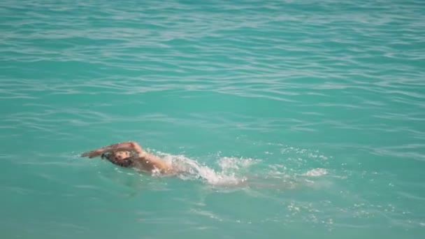 Slow Motion Sportsman Athletic Man Swims Turquoise Water Mediterranean Sea — Stockvideo
