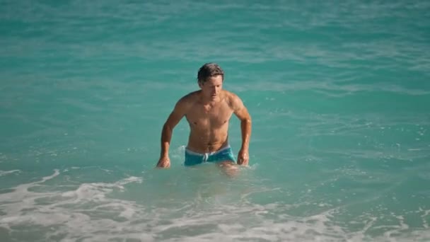Slow Motion Muscular Athletic Man Beach Turquoise Water Mediterranean Sea — стоковое видео