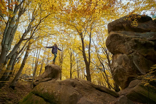 Concept Freedom Exploring World Woman Standing Big Old Boulder Woods — kuvapankkivalokuva