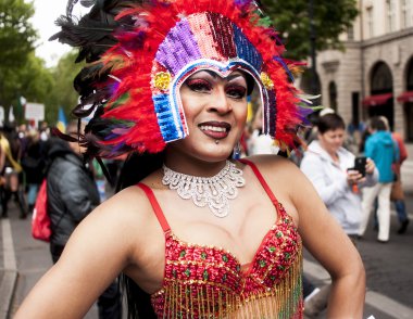 Elaborately dressed transgender during parade clipart