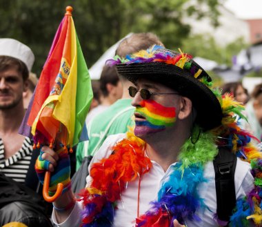 Elaborately dressed man during gay pride parade clipart