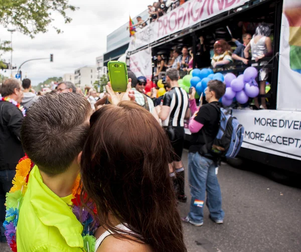 Young couple make selfie during parade — Stock Photo, Image