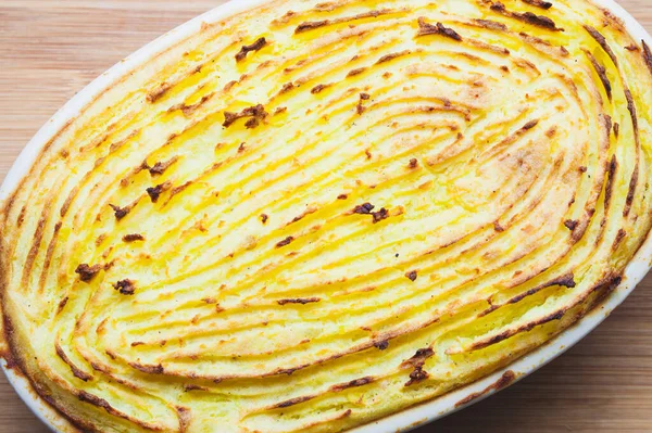 Delicious Potato Gratin Perfectly Baked Patterns Surface Served Oval Ovenproof — Stock Photo, Image