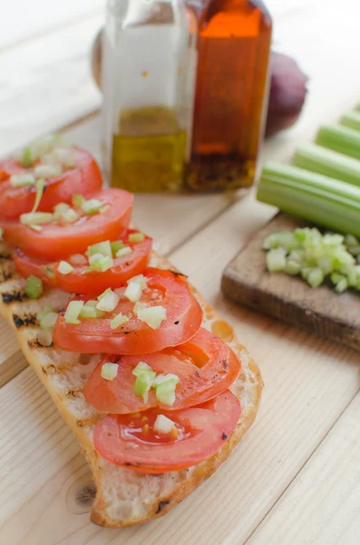 Grilled baguette with grilled tomatoes — Stock Photo, Image