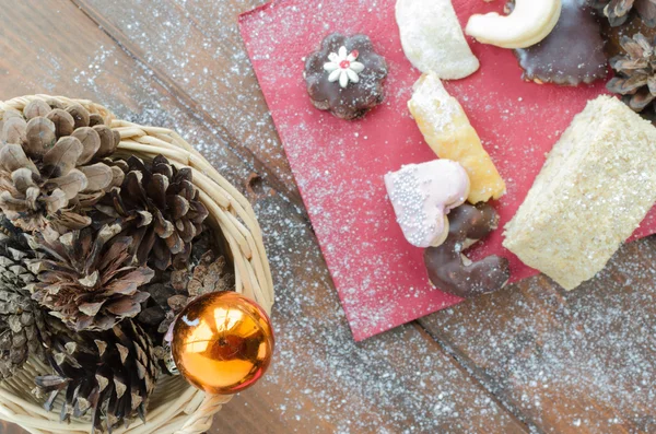 Christmas candy with pinecone in punnet — Stock Photo, Image