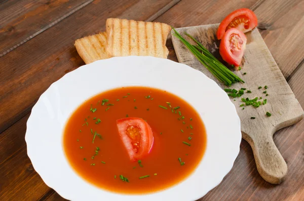 Tomato soup with toast and chive — Stock Photo, Image