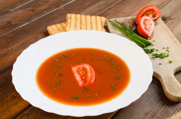 Tomato soup with toast and chive — Stock Photo, Image