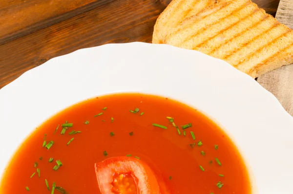 Tomato soup with toast and chive — Stock Photo, Image